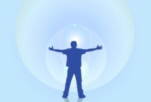 A confident person standing in an open and relaxed posture displaying healthy levels of self-confidence.